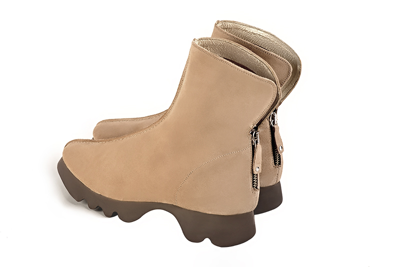 Tan beige women's ankle boots with a zip at the back.. Rear view - Florence KOOIJMAN